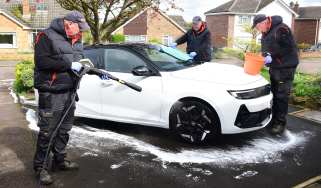 Auto Express products editor Kim Adams washing the Vauxhall Astra GSe